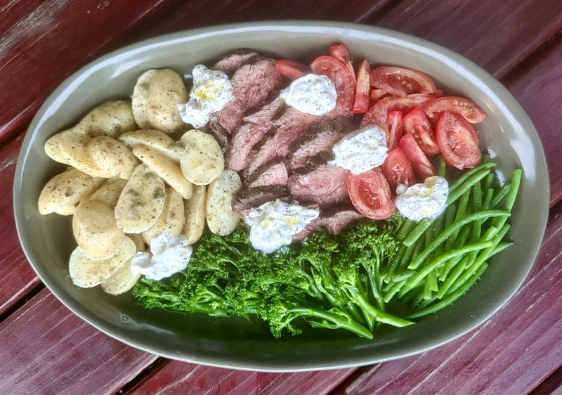 WHAT&rsquo;S COOKING: A steak salad with baby potatoes, broccoli, green beans, tomatoes and two dressings